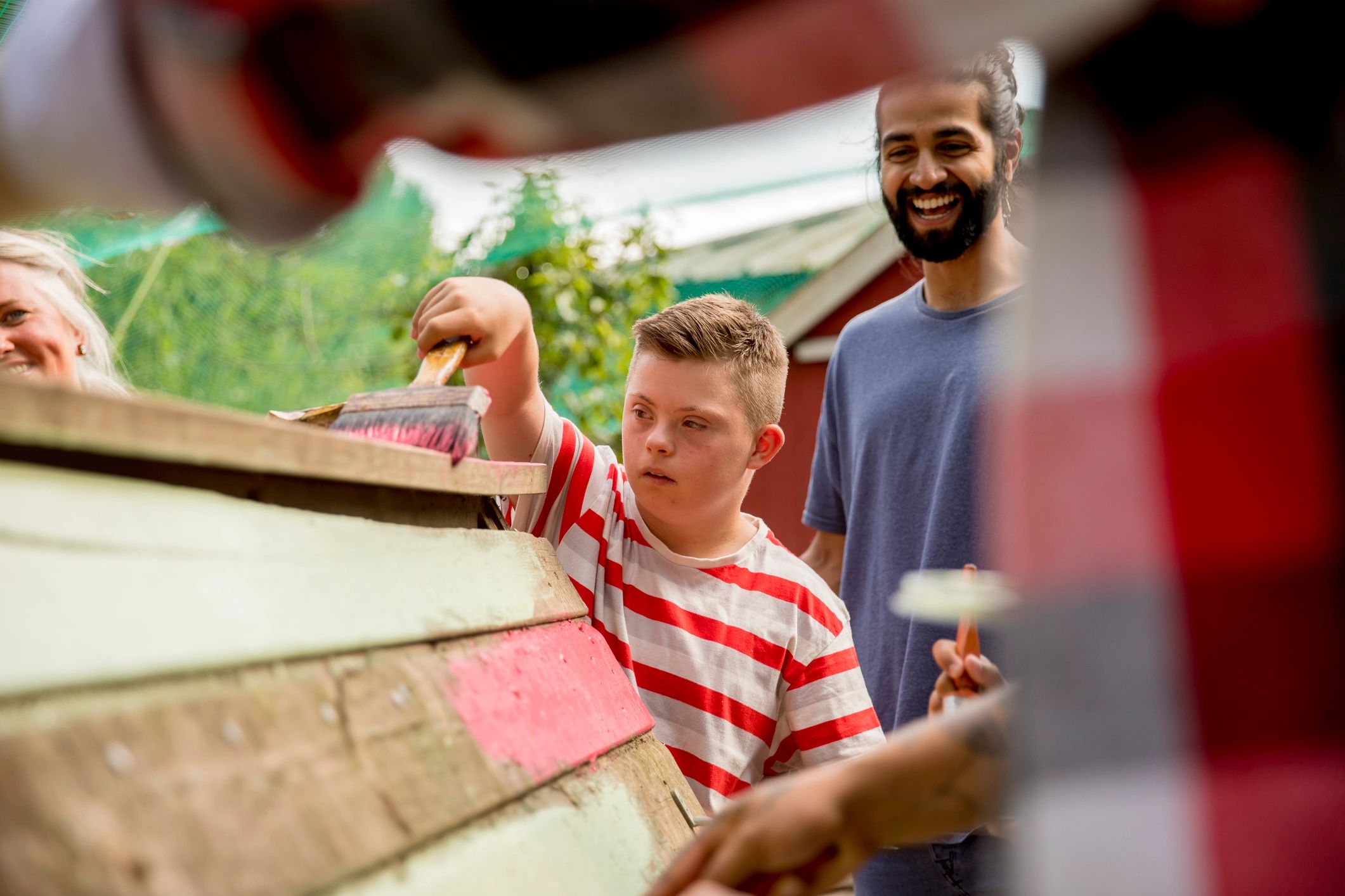 diverse young volunteers helping animals outdoors